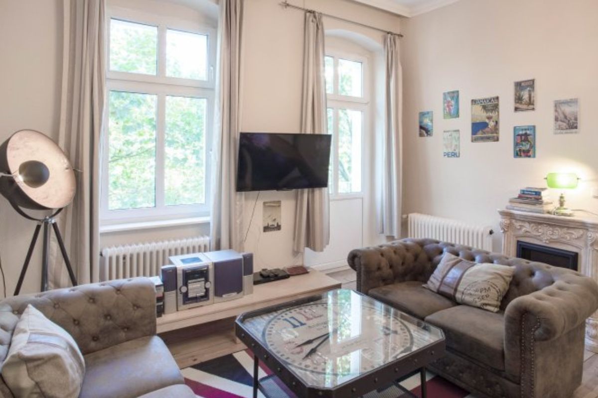 Vacation rental living room with enhanced lighting — original photo